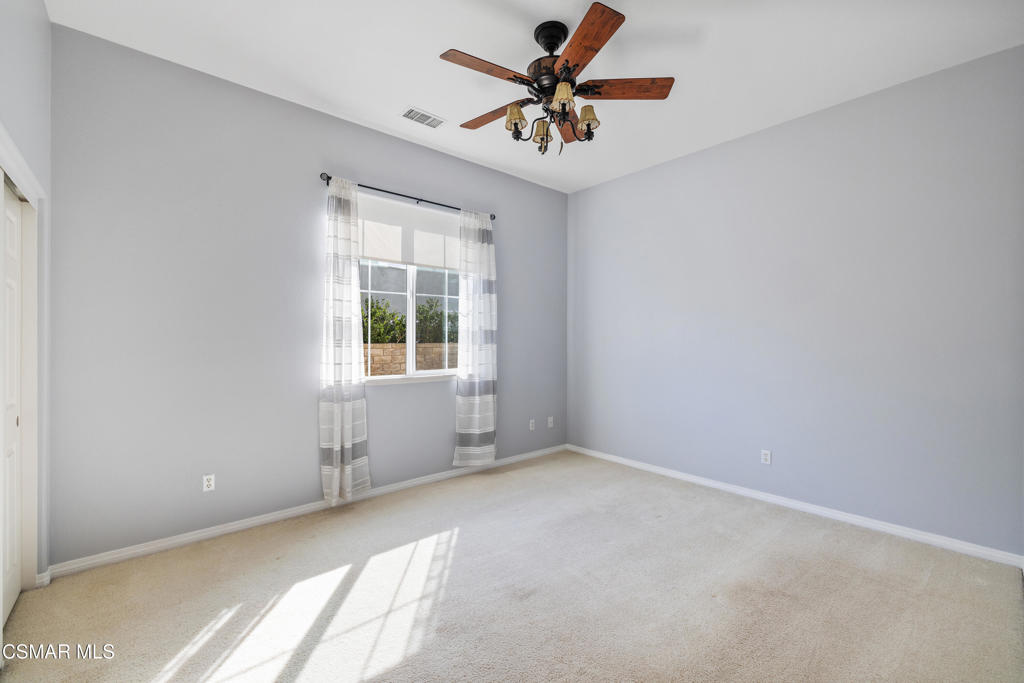 4920 Corral Street Simi Valley, CA 93063 - Photo 23 of 54 an empty room with a window and a fan