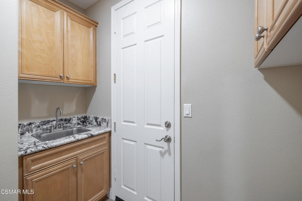 4920 Corral Street Simi Valley, CA 93063 - Photo 28 of 54 a kitchen with a stove and a refrigerator