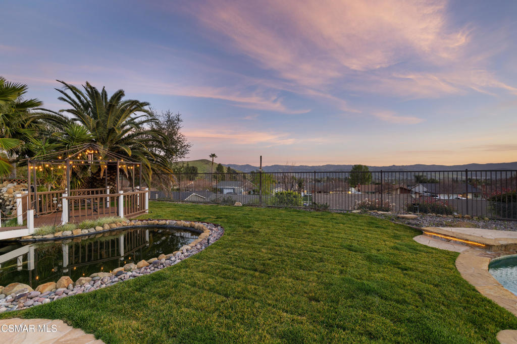 4920 Corral Street Simi Valley, CA 93063 - Photo 35 of 54 a view of a backyard with plants and lake view