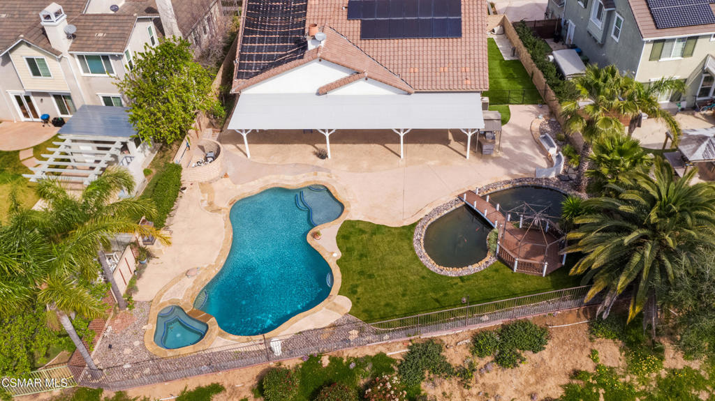 4920 Corral Street Simi Valley, CA 93063 - Photo 44 of 54 an aerial view of a house with garden space and swimming pool