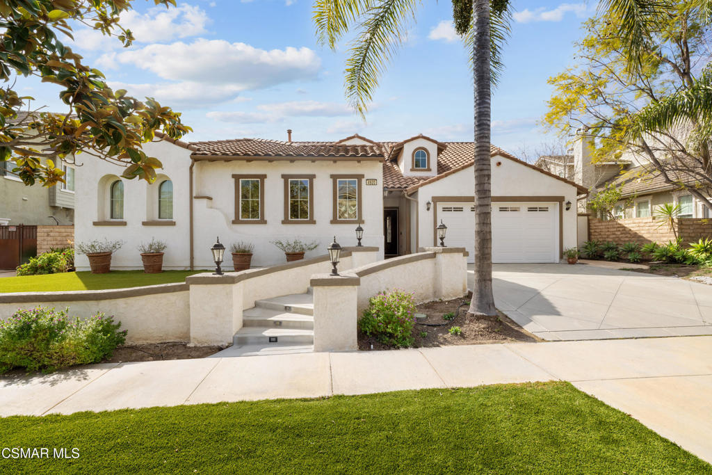 4920 Corral Street Simi Valley, CA 93063 - Photo 8 of 54 a front view of a house with a yard