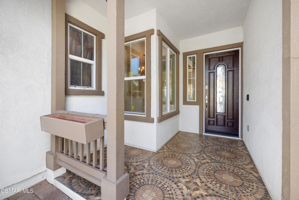 4920 Corral Street Simi Valley, CA 93063 - Photo 9 of 54 a view of a hallway with windows