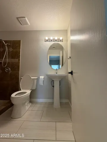 a bathroom with a bathtub and shower