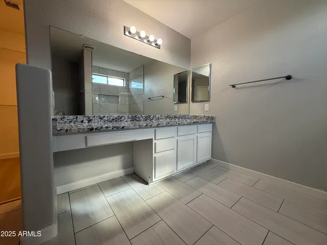 a white toilet sitting in a bathroom