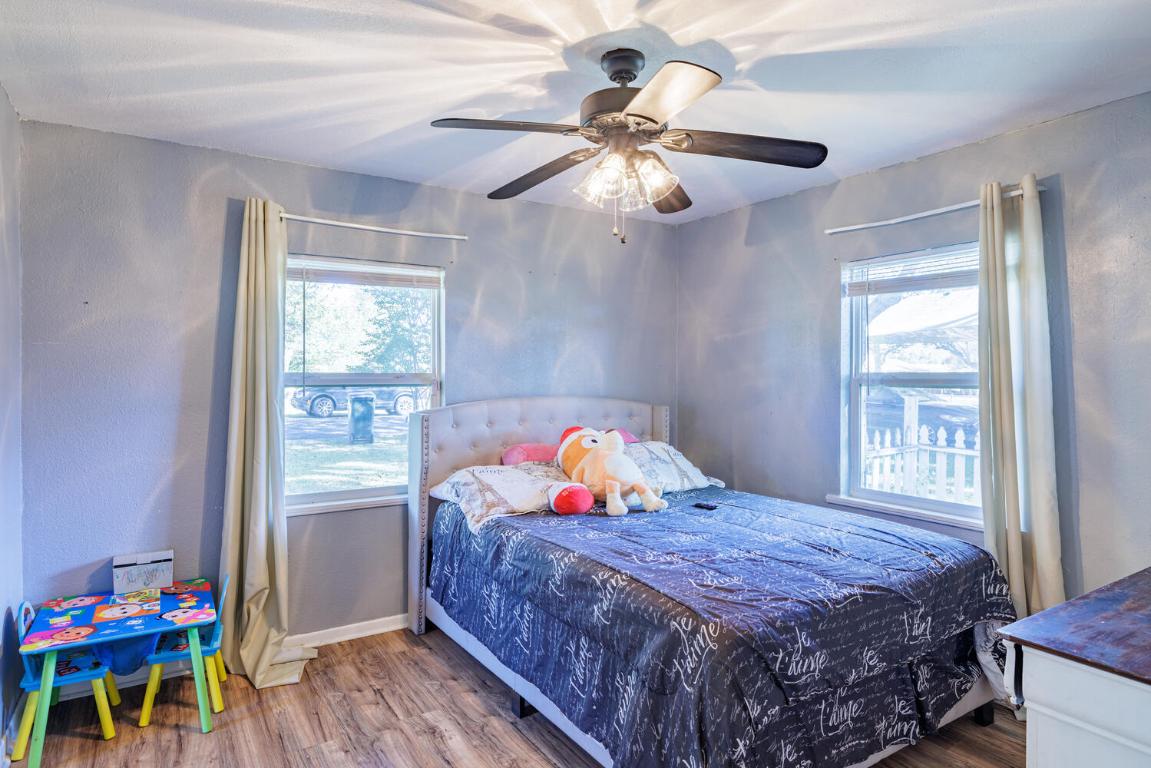 112 Maynard Street Bastrop, TX 78602 - Photo 23 of 35 Bedroom with wood finished floors and a ceiling fan