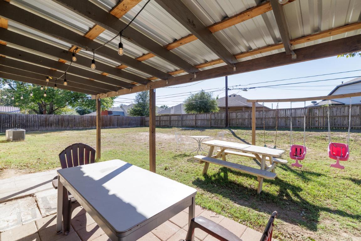 112 Maynard Street Bastrop, TX 78602 - Photo 31 of 35 Fenced backyard featuring a patio and outdoor dining space