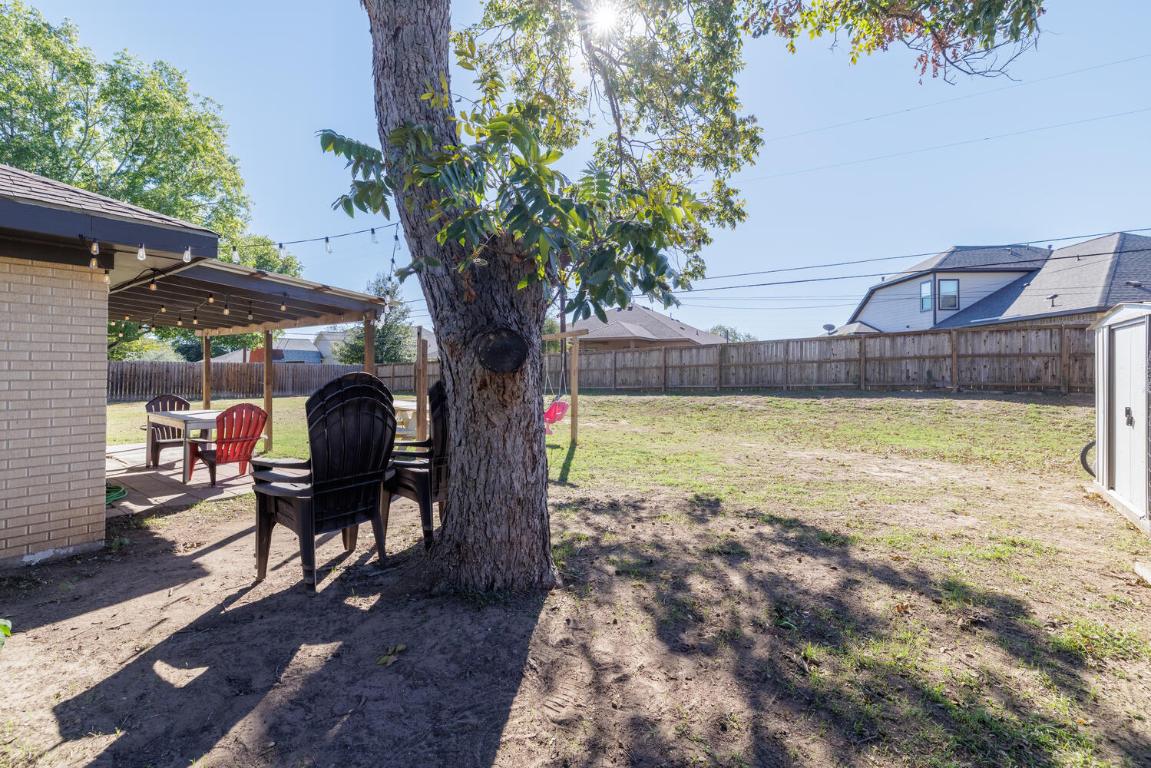 112 Maynard Street Bastrop, TX 78602 - Photo 32 of 35 Fenced backyard featuring a patio area