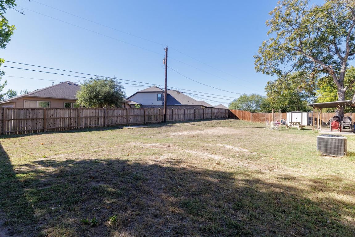 112 Maynard Street Bastrop, TX 78602 - Photo 35 of 35 Fenced backyard featuring a storage shed