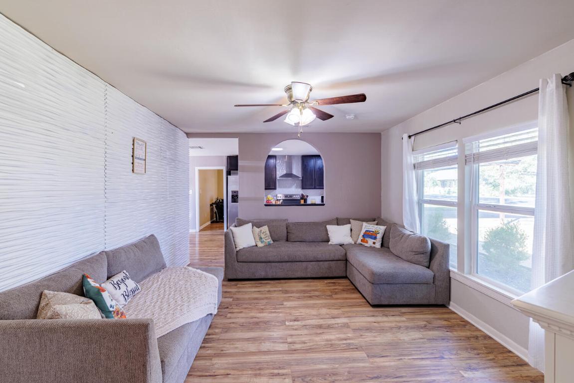 112 Maynard Street Bastrop, TX 78602 - Photo 5 of 35 Living area with light wood-style floors and ceiling fan