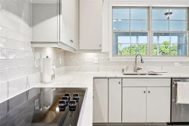 a spacious bedroom with a large bed and a large window