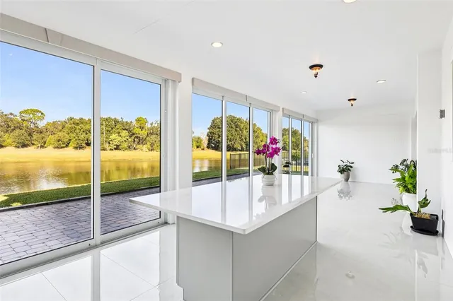 a view of a porch with wooden floor and fence