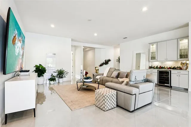 a kitchen with stainless steel appliances kitchen island granite countertop a stove a sink and a refrigerator