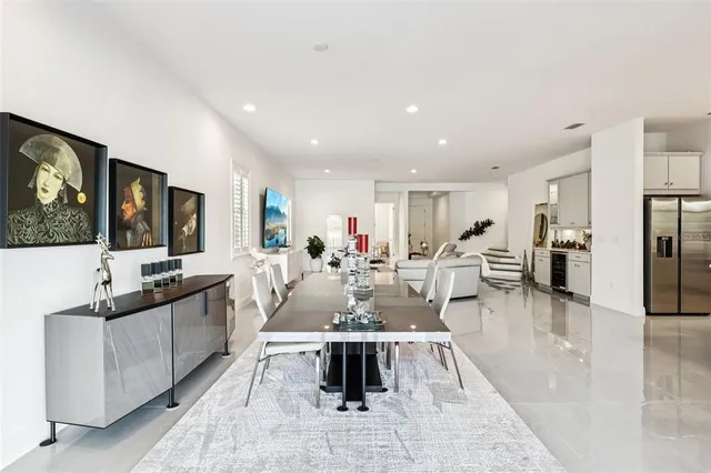 a kitchen with granite countertop a sink and white cabinets