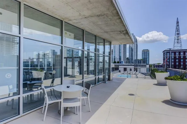 a patio with a table and chairs