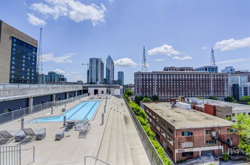 845 Spring Street Northwest, Unit 522 Atlanta, GA 30308 - Photo 18 of 23 a terrace with outdoor seating and city view