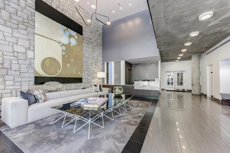 845 Spring Street Northwest, Unit 522 Atlanta, GA 30308 - Photo 21 of 23 a living room with furniture and a fireplace