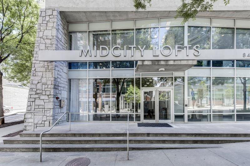 845 Spring Street Northwest, Unit 522 Atlanta, GA 30308 - Photo 22 of 23 a front view of a building with glass windows and door