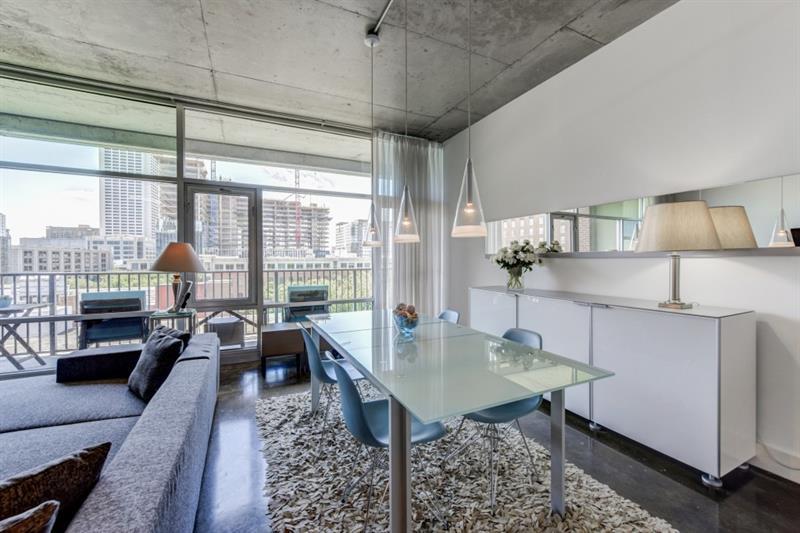 845 Spring Street Northwest, Unit 522 Atlanta, GA 30308 - Photo 4 of 23 a living room with furniture and a table