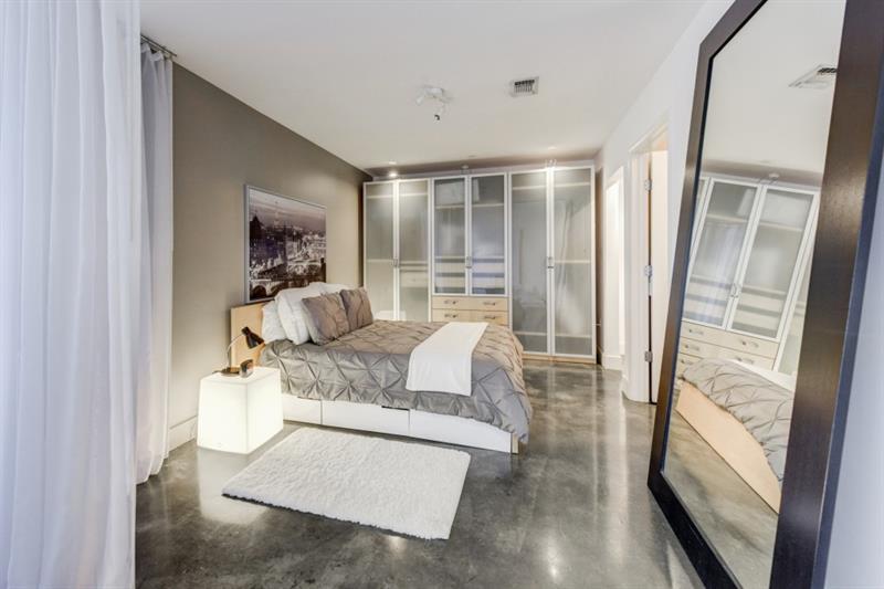 845 Spring Street Northwest, Unit 522 Atlanta, GA 30308 - Photo 5 of 23 a living room with furniture and a large window