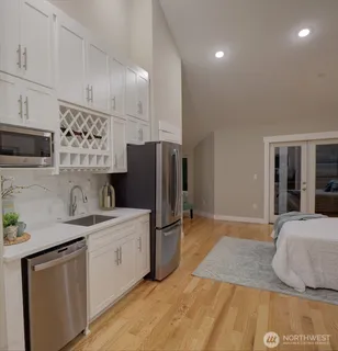 a kitchen with a sink appliances and cabinets