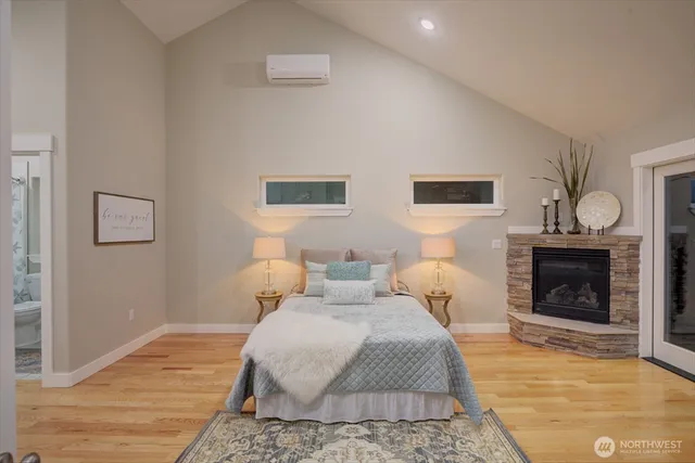 a bedroom with bed and a fireplace