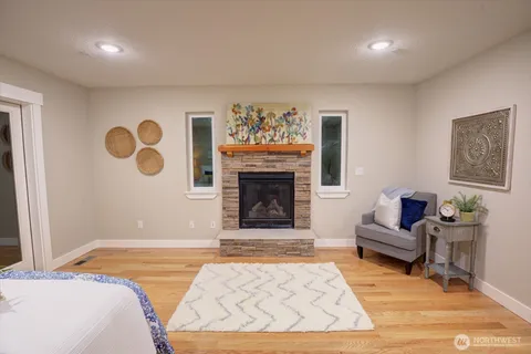 a bedroom with a bed and a couch