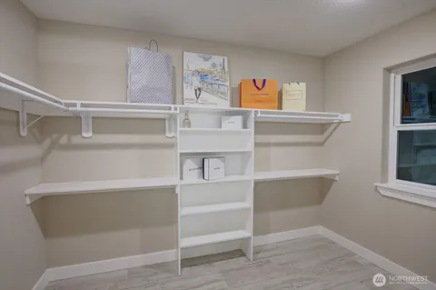 a bathroom with a sink mirror and vanity