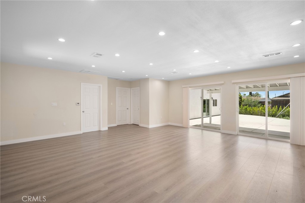 8435 Rincon Avenue Sun Valley, CA 91352 - Photo 5 of 61 a view of an empty room with wooden floor and a window