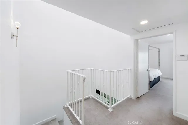 a bed room with a bed and a night stand