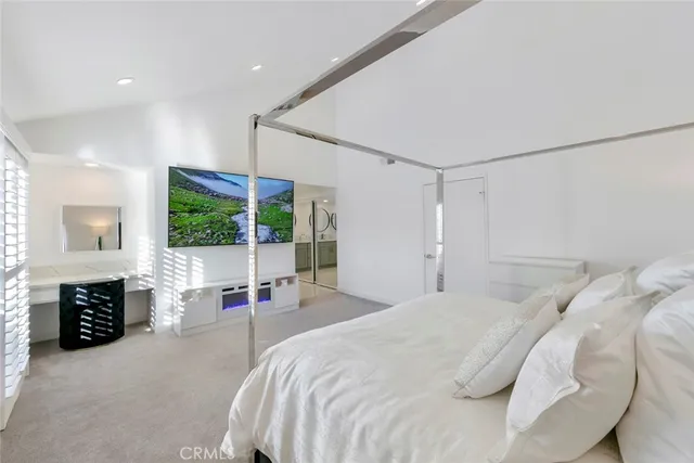 a bathroom with a double vanity sink mirror and shower