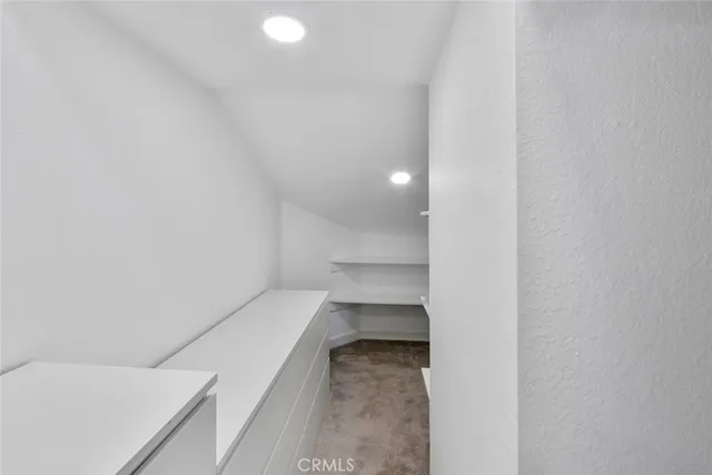 a view of a hallway with workspace and entryway