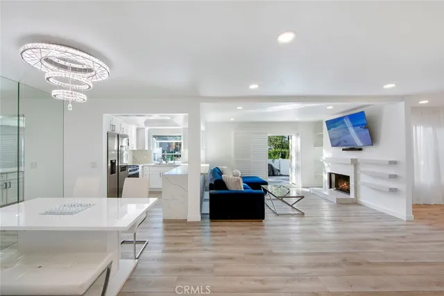 a living room with fireplace furniture and a wooden floor
