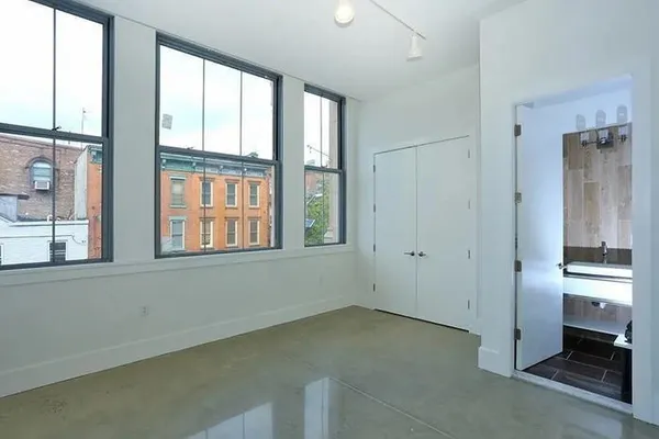 a view of an empty room with a window