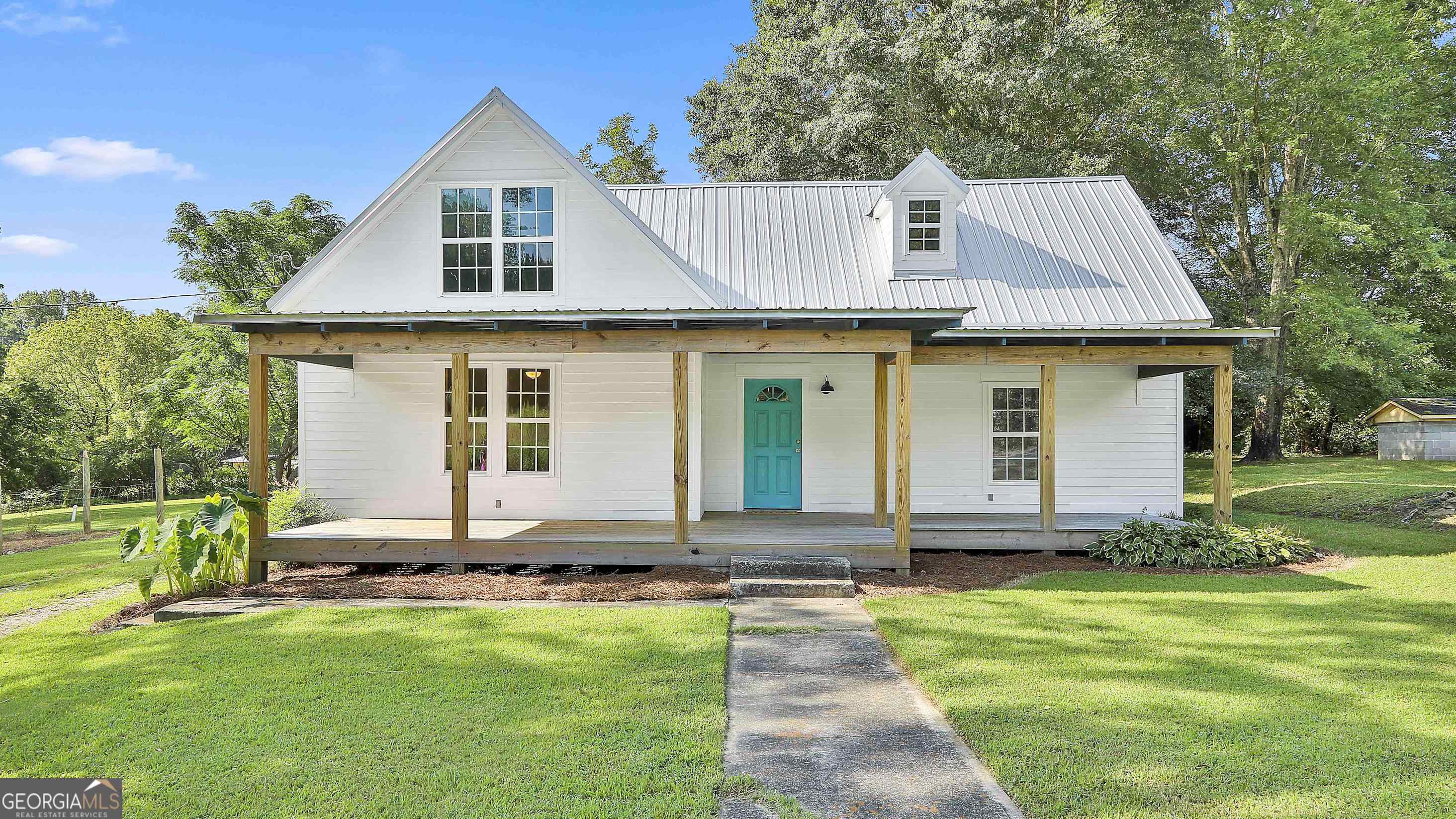 4655 Elgin Road South Fulton, GA 30213 - Photo 1 of 1 a front view of a house with a yard