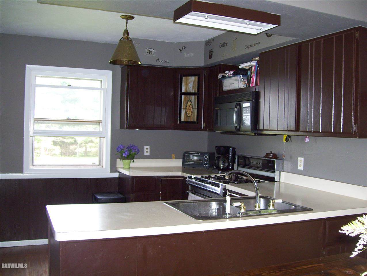 17910 Yale Bridge Road Davis, IL 61019 - Photo 2 of 11 a kitchen with a table and chairs in it