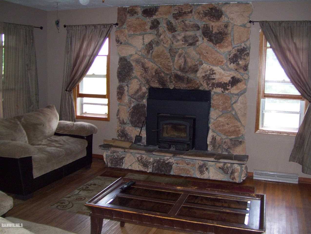 17910 Yale Bridge Road Davis, IL 61019 - Photo 4 of 11 a living room with furniture and a fireplace