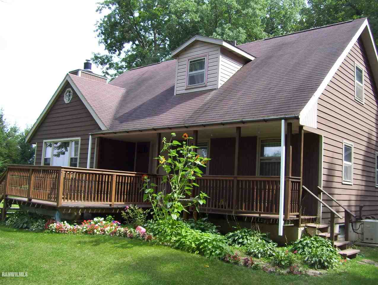 17910 Yale Bridge Road Davis, IL 61019 - Photo 7 of 11 a front view of a house with a garden
