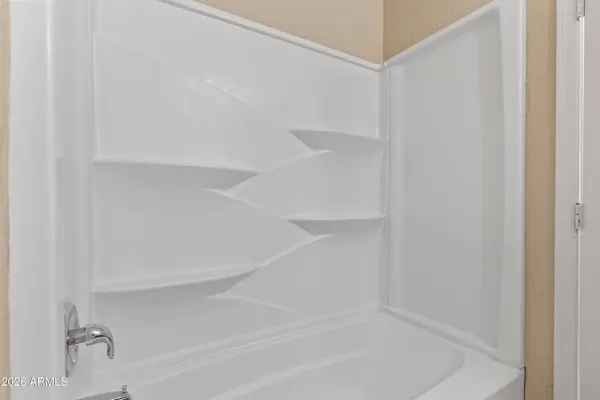 a view of an empty walk in closet