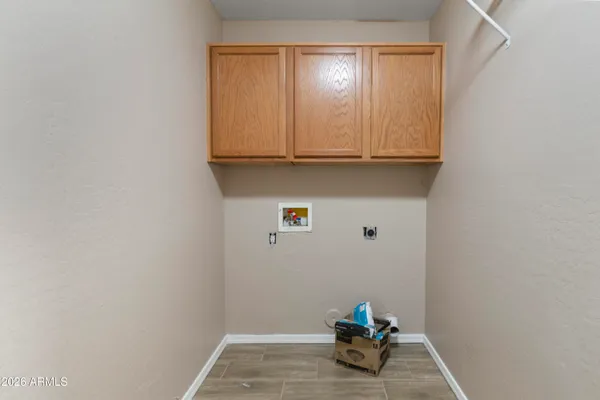a room with a white wall and a window