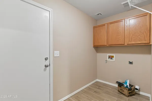 a room with a window and a wooden floor