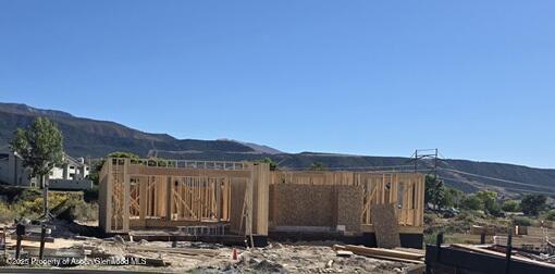 318 Eagle Ridge Drive Parachute, CO 81635 - Photo 3 of 14 a view of a street with a building in the background