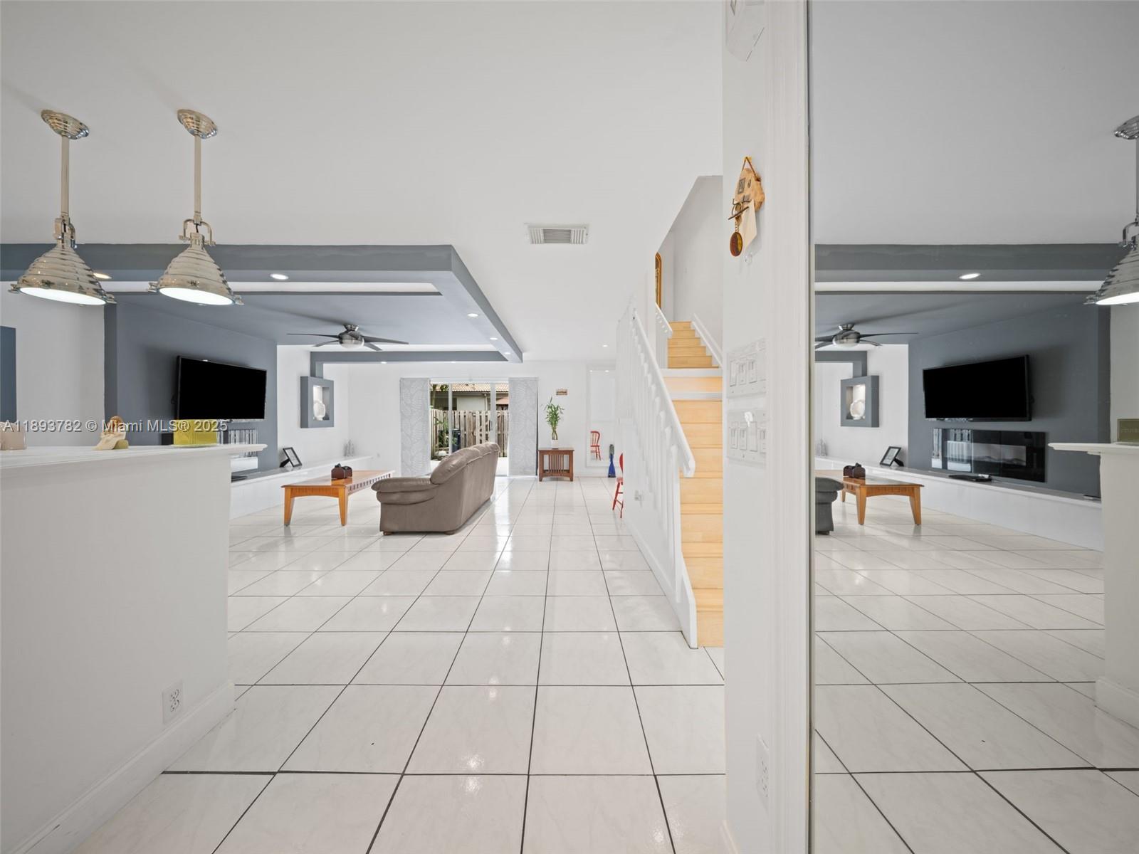 7486 Southwest 162nd Court Miami, FL 33193 - Photo 17 of 47 a view of a living room with furniture and a flat screen tv