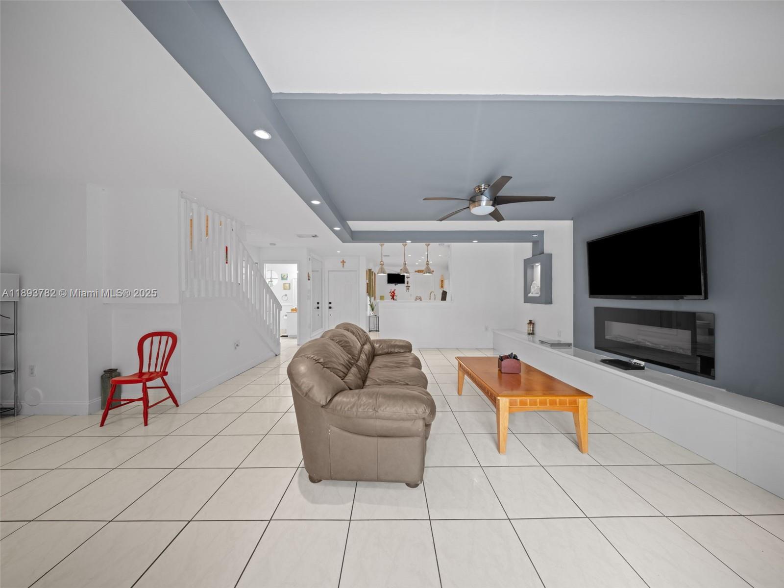 7486 Southwest 162nd Court Miami, FL 33193 - Photo 18 of 47 a living room with furniture and a flat screen tv