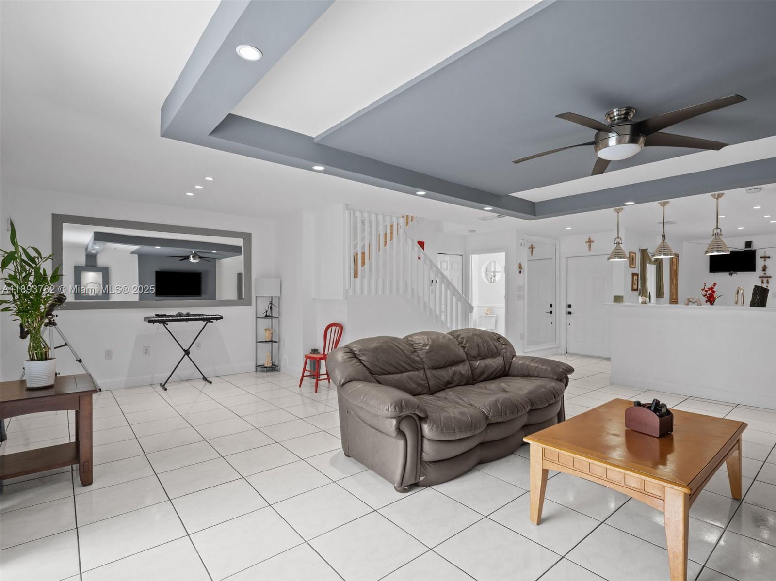 7486 Southwest 162nd Court Miami, FL 33193 - Photo 21 of 47 a living room with furniture and a flat screen tv