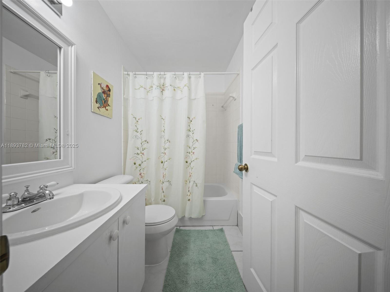 7486 Southwest 162nd Court Miami, FL 33193 - Photo 38 of 47 a bathroom with a sink a toilet and a shower