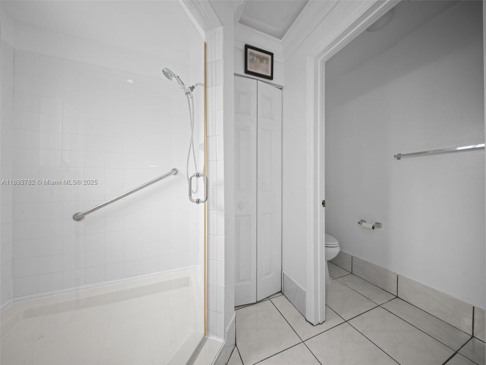 7486 Southwest 162nd Court Miami, FL 33193 - Photo 42 of 47 a bathroom with a granite countertop shower and toilet