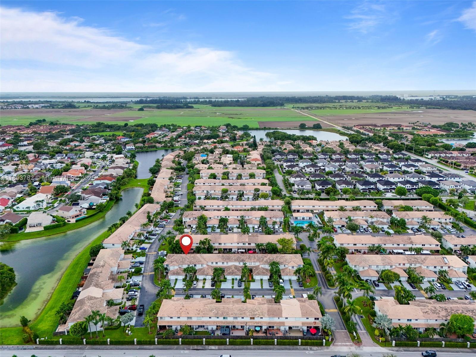 7486 Southwest 162nd Court Miami, FL 33193 - Photo 46 of 47 an aerial view of a city with lots of residential buildings ocean and mountain view in back