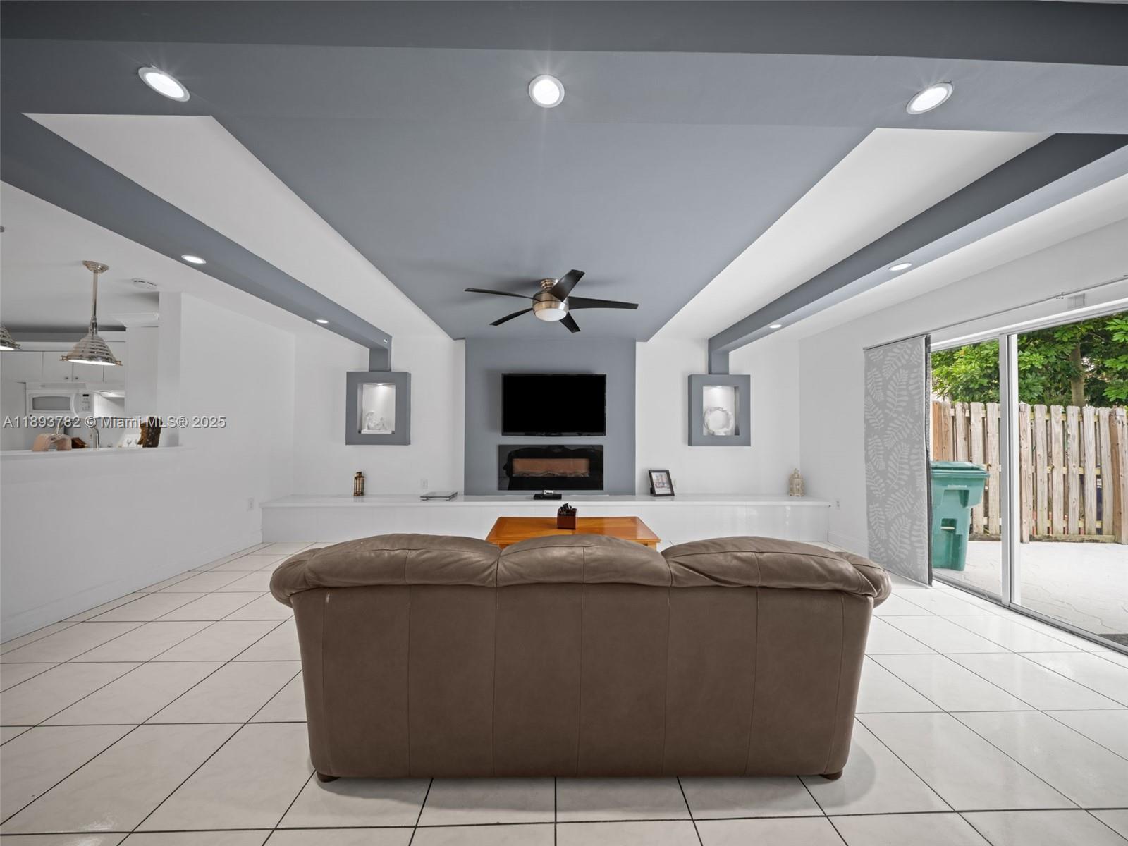 7486 Southwest 162nd Court Miami, FL 33193 - Photo 6 of 47 a living room with furniture and flat screen tv