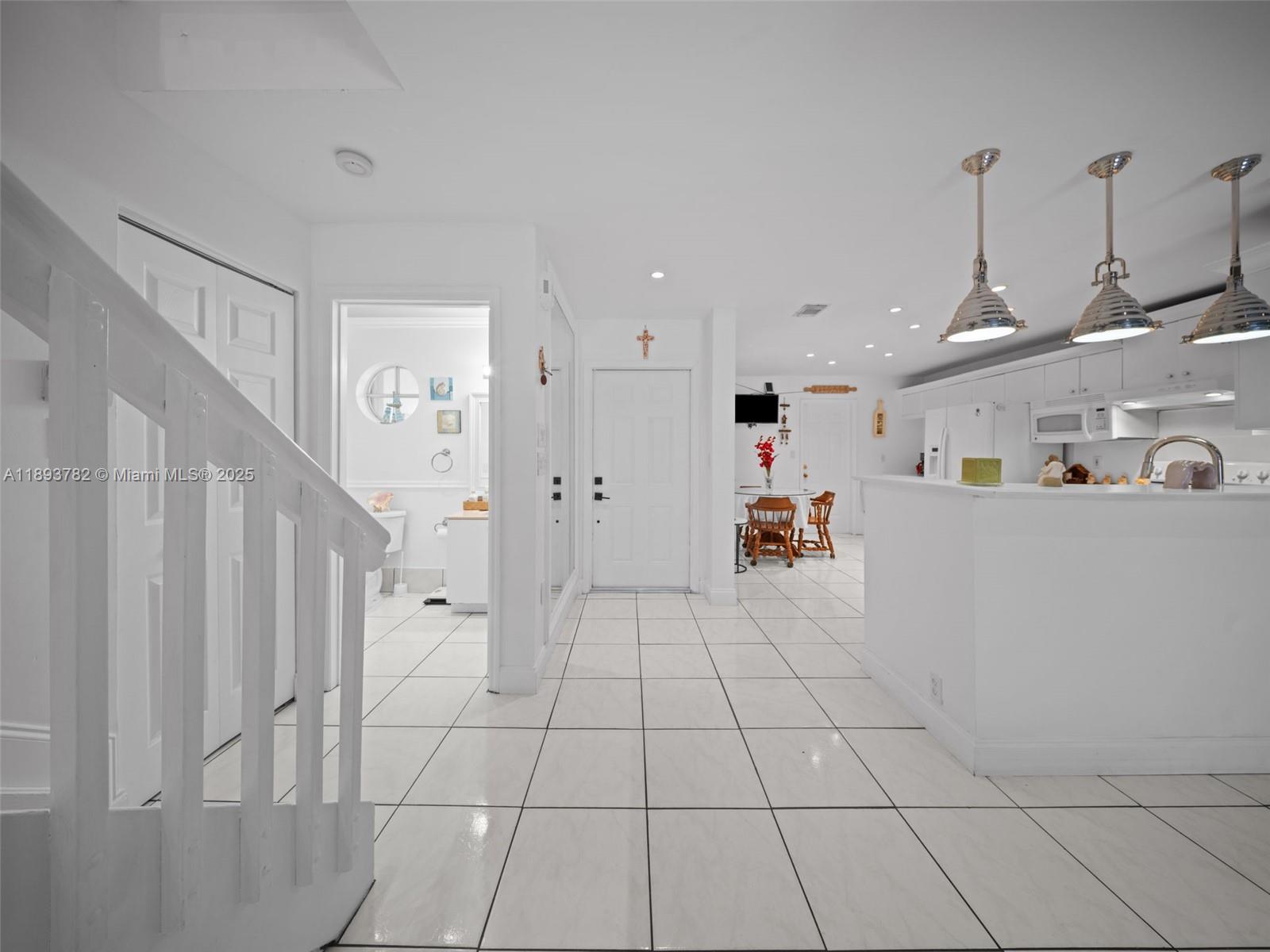 7486 Southwest 162nd Court Miami, FL 33193 - Photo 7 of 47 a view of an empty room