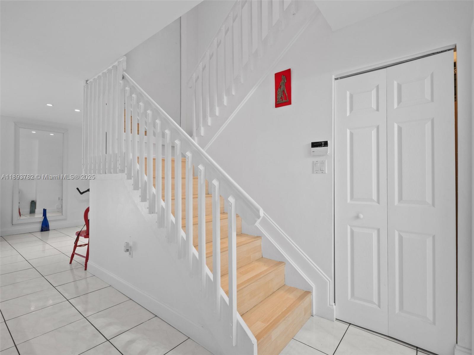 7486 Southwest 162nd Court Miami, FL 33193 - Photo 9 of 47 a view of entryway and hall with wooden floor